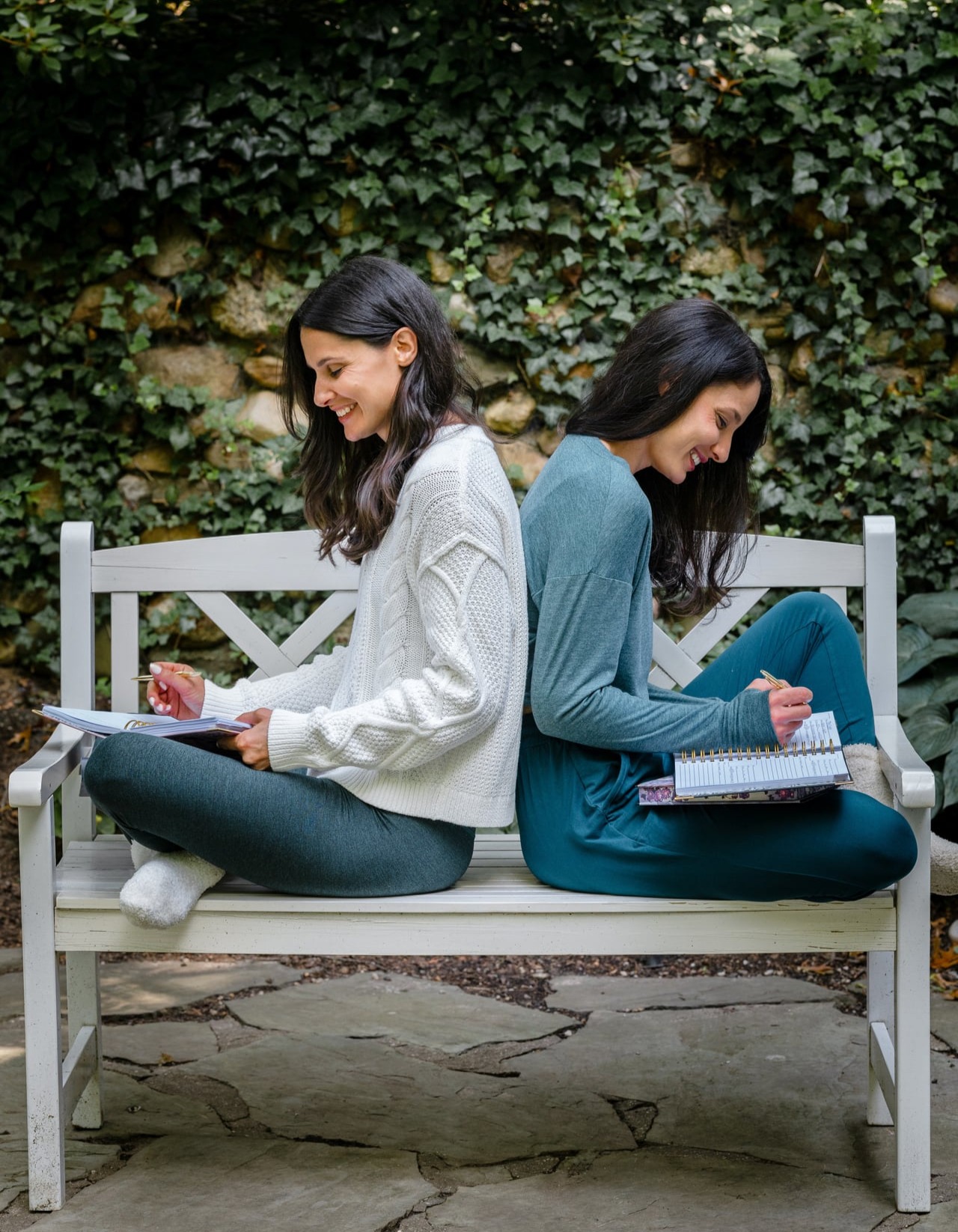 Ali and Kim on bench reading